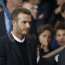 Former soccer player David Beckham arrive to attend the Champions League Group F soccer match between Paris St Germain and Barcelona at the Parc des Princes Stadium in Paris, September 30, 2014.    REUTERS/Benoit Tessier