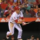Los Angeles Angels' Mike Trout hits a solo home run during the seventh inning of their baseball game against the Chicago White Sox, Friday, Sept. 21, 2012, in Anaheim, Calif. AP Photo/Mark J. Terrill)