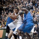 Missouri's Alex Oriakhi, left, fights his way past Florida's Patric Young, right, as he heads to the basket during the first half of an NCAA college basketball game Tuesday, Feb. 19, 2013, in Columbia, Mo. (AP Photo/L.G. Patterson)