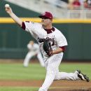 South Carolina starting pitcher Colby Holmes works against Arkansas in the first inning of an NCAA College World Series baseball game in Omaha, Neb., Monday, June 18, 2012. (AP Photo/Nati Harnik)
