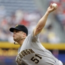 Pittsburgh Pirates starting pitcher Wandy Rodriguez throws in the first inning of a baseball game against the Atlanta Braves, Wednesday, June 5, 2013, in Atlanta. (AP Photo/David Goldman)