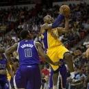 Los Angeles Lakers' Kobe Bryant (24) drives in for a shot against Sacramento Kings' Thomas Robinson (0) in the first quarter of a preseason NBA basketball game, Friday, Oct. 19, 2012, in Las Vegas. (AP Photo/Julie Jacobson)