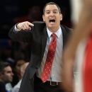 FILE - In this March 12, 2013, file photo, Rutgers coach Mike Rice yells out to his team during an NCAA college basketball game against DePaul at the Big East tournament in New York. Rutgers said it would reconsider its decision to retain Rice after a videotape aired showing him shoving, grabbing and throwing balls at players in practice and using gay slurs. The videotape, broadcast Tuesday, April 2, on ESPN, prompted scores of outraged social media comments as well as sharp criticism from Gov. Chris Christie and NBA star LeBron James. (AP Photo/Frank Franklin II, File)