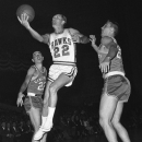 FILE - In this Oct. 31, 1959, file photo, St. Louis Hawks' Slater Martin (22) leaps to make a basket in the first period of an NBA basketball game against the Cincinnati Royals in St, Louis. Martin, the Hall of Fame guard who won four NBA titles with the Minneapolis Lakers and one with the St. Louis, died Thursday, Oct. 18, 2012. He was 86. (AP Photo/File)
