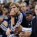 Dallas Mavericks' forward Dirk Nowitzki, second left, watches his teammates during an exhibition basketball game against FC Barcelona in Barcelona, Spain, Tuesday, Oct. 9, 2012. (AP Photo / Manu Fernandez)