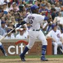 Chicago Cubs' Alfonso Soriano hits a home run off San Diego Padres starting pitcher Eric Stults during the sixth inning of a baseball game Tuesday, May 29, 2012, in Chicago. (AP Photo/Charles Rex Arbogast)