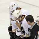 Anaheim Ducks' Teenu Selanne (8) is helped off the ice after getting injured in the third period of an NHL hockey game against the Philadelphia Flyers, Tuesday Oct. 29, 2013, in Philadelphia. The Ducks won 3-2. (AP Photo/H. Rumph Jr)