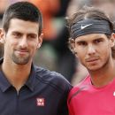 Rafael Nadal of Spain and Novak Djokovic of Serbia pose for photographers ahead of the mens final match at the French Open tennis tournament in Roland Garros stadium in Paris, Monday June 11, 2012. Rain suspended the final making it the first French Open not to end on Sunday since 1973. Nadal is trying to pass Bjorn Borg as the all-time record-holder for French Open titles, and Djokovic is trying to become the first player since Rod Laver to win four straight Grand Slam tournaments. (AP Photo/Bernat Armangue)