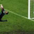 Greece goalkeeper Michalis Sifakis fails to make a save as Germany's Philipp Lahm, unseen, scores the opening goal during the Euro 2012 soccer championship quarterfinal match between Germany and Greece in Gdansk, Poland, Friday, June 22, 2012. (AP Photo/Gero Breloer)