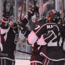 The Los Angeles Kings celebrate a second period goal by Alec Martinez against the New Jersey Devils during Game 3 of the Stanley Cup Finals, Monday, June 4, 2012, in Los Angeles.  (AP Photo/Mark J. Terrill)