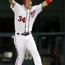 Washington Nationals' Bryce Harper, center, reacts after his hit scored the winning run during the 12th inning of a baseball game against the New York Mets, Tuesday, June 5, 2012, in Washington. The Nationals won 7-6. (AP Photo/Alex Brandon)