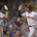 San Francisco Giants' Joaquin Arias, right, is congratuated by Barry Zito after hitting a solo home run during the third inning of the Giants' baseball game against the Los Angeles Dodgers, Tuesday, Oct. 2, 2012, in Los Angeles. (AP Photo/Mark J. Terrill)