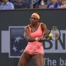 CORRECTS DAY AND DATE - Serena Williams returns to Monica Niculescu, of Romania, in a qualifying tennis match at the BNP Paribas Open tennis tournament, Friday, March 13, 2015, in Indian Wells, Calif. (AP Photo/Mark J. Terrill)