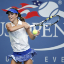 CiCi Bellis, of the United States, returns a shot against Renata Zarazua, of Mexico, during the first round of juniors play at the 2014 U.S. Open tennis tournament, Monday, Sept. 1, 2014, in New York. (AP Photo/Seth Wenig)