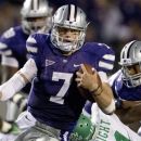 Kansas State quarterback Collin Klein (7) gets past North Texas linebacker Will Wright (11) during the second half of an NCAA college football game in Manhattan, Kan., Saturday, Sept. 15, 2012. (AP Photo/Orlin Wagner)
