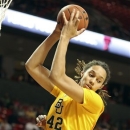 Baylor's Brittney Griner grabs a rebound against Texas Tech during an NCAA college basketball game in Lubbock, Texas, Wednesday, Jan. 30, 2013. (AP Photo/Zach Long)