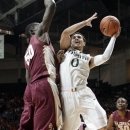 Miami's Shane Larkin (0) prepares to shoot against Florida State's Michael Ojo (50) during the first half of an NCAA college basketball game in Coral Gables, Fla., Sunday, Jan. 27, 2013. (AP Photo/Alan Diaz)
