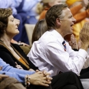 Tennessee Gov. Bill Haslam, right, cheers as he sits with Pat Summitt, left, Tennessee head coach emeritus, in the first half of an NCAA basketball game between Tennessee and Vanderbilt, Thursday, Jan. 24, 2013, in Nashville, Tenn. (AP Photo/Mark Humphrey)