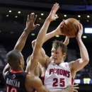 Toronto Raptors guard DeMar DeRozan (10) puts the pressure on Detroit Pistons forward Kyle Singler (25) in the first half of an NBA basketball game, Friday, Nov. 23, 2012, in Auburn Hills, Mich. (AP Photo/Duane Burleson)