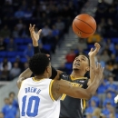 Missouri's Phil Pressey, right, and UCLA's Larry Drew II fight for a loose ball during the first half of an NCAA college basketball game in Los Angeles, Friday, Dec. 28, 2012. (AP Photo/Jae C. Hong)