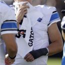Detroit Lions quarterback Matthew Stafford (9) has his hand in a cast after coming out of the game during the first half of a preseason NFL football game against the Oakland Raiders in Oakland, Calif., Saturday, Aug. 25, 2012. (AP Photo/Ben Margot)