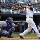 New York Yankees' Lyle Overbay, right, hits a two-run home run off Toronto Blue Jays starting pitcher R.A. Dickey in the seventh inning of a baseball game at Yankee Stadium, Sunday, April 28, 2013, in New York. (AP Photo/Kathy Kmonicek)