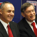 Major League Baseball commissioner Bud Selig, right, and MLB Vice President of Labor Relations Rob Manfred, react during a news conference announcing a five-year collective bargaining agreement, Tuesday, Nov. 22, 2011 in New York. (AP Photo/Bebeto Matthews)