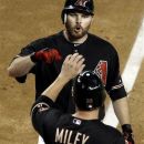 Arizona Diamondbacks' Jason Kubel celebrates his three-run home against the Houston Astros with teammate Wade Miley in the fourth inning during a baseball game Saturday, July 21, 2012, in Phoenix. (AP Photo/Ross D. Franklin)