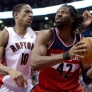 Toronto Raptors guard DeMar DeRozan (10) defends against Washinton Wizards center Nene (42) during the second half of their NBA basketball game, Monday, Feb. 25, 2013, in Toronto. The Wizards won 90-84. (AP Photo/The Canadian Press, Frank Gunn)