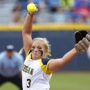 Michigan's Megan Betsa pitches in the first inning against Alabama during an NCAA softball Women's College World Series game in Oklahoma City, Thursday, May 28, 2015. (AP Photo/Alonzo Adams)