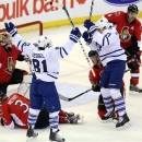 Maple Leafs' Phil Kessel (81) celebrates a goal by teammate James van Riemsdyk (21) during second period NHL action against the Ottawa Senators in Ottawa Saturday April 20, 2013. (AP Photo/The Canadian Press, Fred Chartrand)