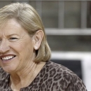 North Carolina coach Sylvia Hatchell, smiles at a player before North Carolina's NCAA college basketball game against Boston College in Boston on Thursday, Feb. 7, 2013. (AP Photo/Winslow Townson)