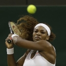 Serena Williams of the United States plays a return to Kimiko Date-Krumm of Japan during their Women's singles match at the All England Lawn Tennis Championships in Wimbledon, London, Saturday, June 29, 2013. (AP Photo/Anja Niedringhaus)