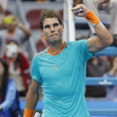Rafael Nadal of Spain celebrates after winning his match against Peter Gojowczyk of Germany during the China Open tennis tournament at the National Tennis Stadium in Beijing, China, Thursday, Oct. 2, 2014. (AP Photo/Vincent Thian)