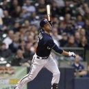 Milwaukee Brewers' Ryan Braun watches his two-run home run against the Colorado Rockies during the third inning of a baseball game Tuesday, April 2, 2013, in Milwaukee. (AP Photo/Jeffrey Phelps)