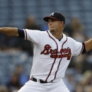 Atlanta Braves starting pitcher Mike Minor works in the first inning of a baseball game against the Colorado Rockies in Atlanta, Wednesday, July 31, 2013. (AP Photo/John Bazemore)