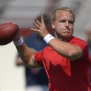 FILE - In this March 27, 2013 file photo, Southern California quarterback Matt Barkley passes during NFL Pro Day at the University of Southern California, in Los Angeles. When the NFL Draft rolls around, the second-guessing officially begins as some of college football's highest-profile quarterbacks find out if an extra year in school cost them millions of dollars. (AP Photo/Mark J. Terrill, File)