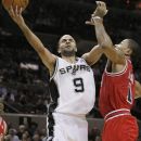 San Antonio Spurs' Tony Parker, left, of France, shoots over Chicago Bulls' Derrick Rose during the first half of an NBA basketball game on Wednesday, Feb. 29, 2012, in San Antonio. (AP Photo/Darren Abate)