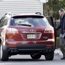 Former Rutgers men's basketball coach Mike Rice leaves his home Wednesday, April 3, 2013, in Little Silver, N.J. Rice was fired Wednesday after a videotape aired showing Rice using gay slurs, shoving and grabbing his players and throwing balls at them in practice. Athletic director Tim Pernetti was given a copy of the tape by a former employee in November and, after an independent investigator was hired to review it, Rice was suspended for three games, fined $75,000 and ordered to attend anger management classes. University president Robert Barchi signed off on the penalty. But on Wednesday, Rutgers referred to new information and 