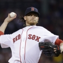 Boston Red Sox starting pitcher Clay Buchholz throws in the first inning during Game 6 of the American League baseball championship series against the Detroit Tigers on Saturday, Oct. 19, 2013, in Boston. (AP Photo/Matt Slocum)
