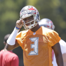 Tampa Bay Buccaneers quarterback Jameis Winston calls out a play during drills in an NFL rookie minicamp in Tampa, Fla., Friday, May 8, 2015. (AP Photo/Wilfredo Lee)