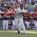 Los Angeles Dodgers closer Kenley Jansen throws Los Angeles Angels' Howard Kendrick out at first during the ninth inning of a baseball game in Anaheim, Calif., Saturday, June 23, 2012. The Dodgers won 3-1. (AP Photo/Chris Carlson)