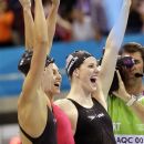United States'  women's 4 x 100-meter medley relay team Dana Vollmer, right, Rebecca Soni, center, and Missy Franklin, left, celebrate as their teammate finishes, winning the yeam a gold medal, at the Aquatics Centre in the Olympic Park during the 2012 Summer Olympics in London, Saturday, Aug. 4, 2012. (AP Photo/Lee Jin-man)