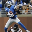 Detroit Lions wide receiver Calvin Johnson (81) gains 18-yards on a pass reception under pressure from Chicago Bears cornerback Charles Tillman (33) during the third quarter of an NFL football game at Ford Field in Detroit, Sunday, Dec. 30, 2012. (AP Photo/Rick Osentoski)