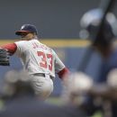 Washington Nationals starting pitcher Edwin Jackson throws to a Milwaukee Brewers batter during the first inning of a baseball game Thursday, July 26, 2012, in Milwaukee. (AP Photo/Jeffrey Phelps)