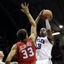 Butler forward Khyle Marshall, right, shoots over Richmond forward Alonzo Nelson-Ododa in the first half of an NCAA college basketball game in Indianapolis, Wednesday, Jan. 16, 2013. (AP Photo/Michael Conroy)