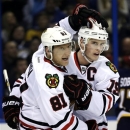 Chicago Blackhawks' Jonathan Toews, right, is congratulated by Marian Hossa, of Slovakia, after Toews scored his second goal of an NHL hockey game during the third period against the St. Louis Blues, Thursday, Feb. 28, 2013, in St. Louis. The Blackhawks won 3-0. (AP Photo/Jeff Roberson)
