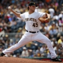 Pittsburgh Pirates' Gerrit Cole (45) delivers during the second inning of a baseball game against the Miami Marlins in Pittsburgh, Wednesday, May 27, 2015. (AP Photo/Gene J. Puskar)