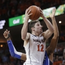 Virginia guard Joe Harris (12) goes up for a shot in front of Duke forward Josh Hairston (15) during the second half of an NCAA college basketball game in Charlottesville, Va., Thursday, Feb. 28, 2013. Harris had 36 points as Virginia won 73-68. (AP Photo/Steve Helber)