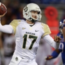Baylor Bears quarterback Seth Russell throws in the third quarter of an NCAA college football game against the Kansas Jayhawks, Saturday, Oct. 26, 2013, in Lawrence, Kan. Baylor won 59-14. (AP Photo/Ed Zurga)